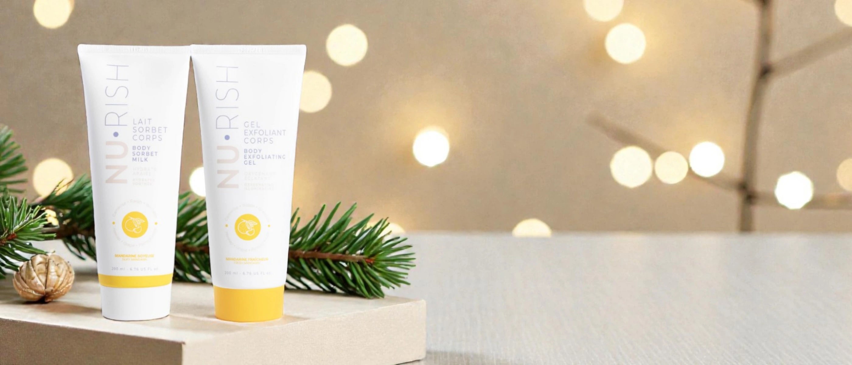 bannière de noel avec le gel exfoliant pour le corps de chez nurish et le lait pour le corps