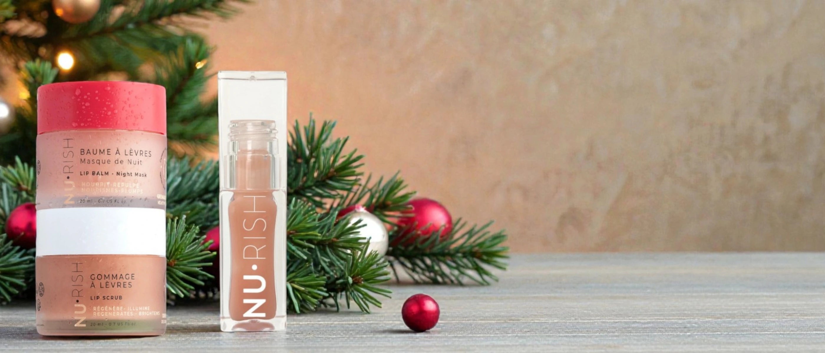 bannière de noel avec le baume pour les lèvres de chez nurish, le gommage et l'huile à lèvre
